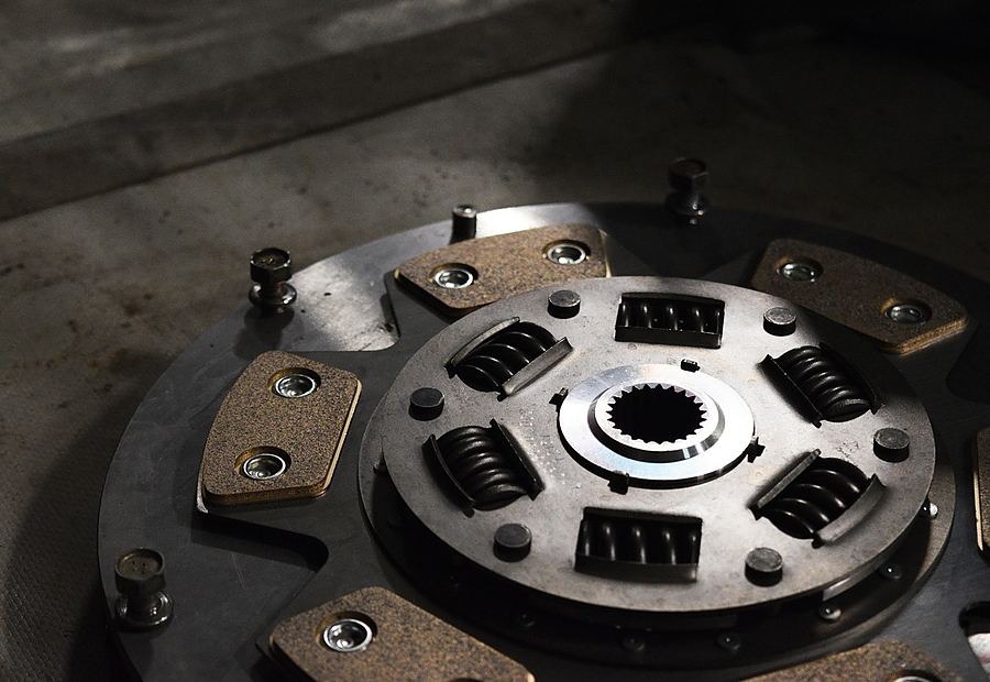 Mechanic handling clutch replacement parts